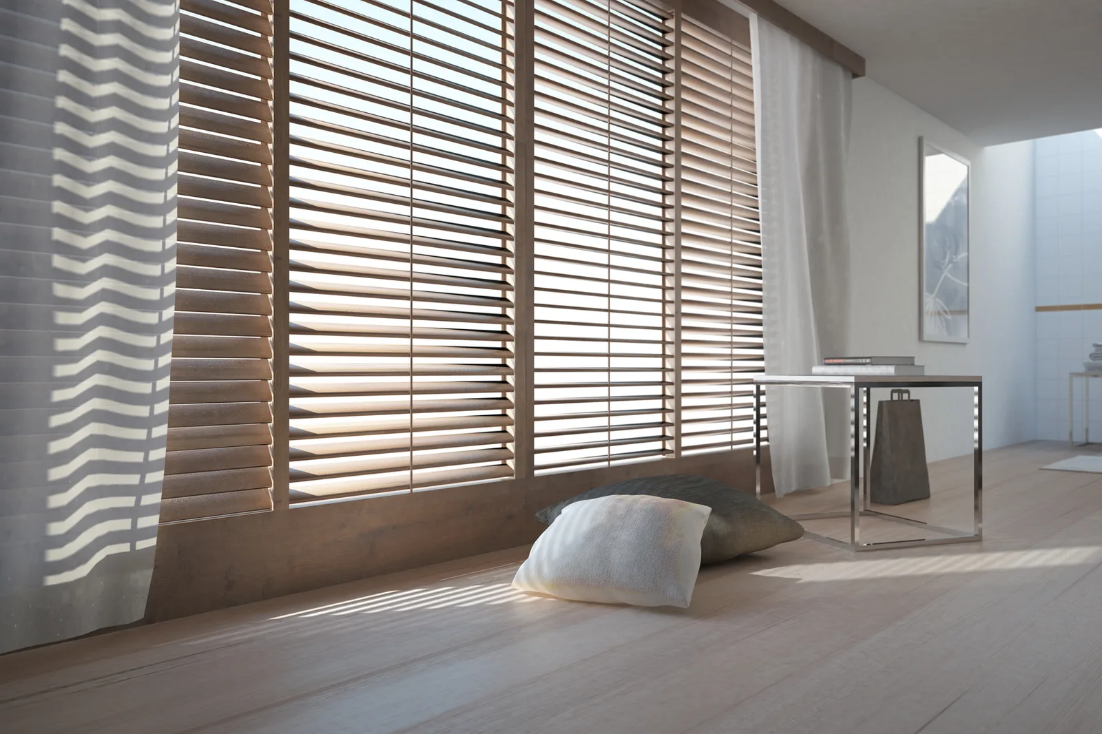 Wide wooden shutter louvers filtering afternoon light across a pale timber floor